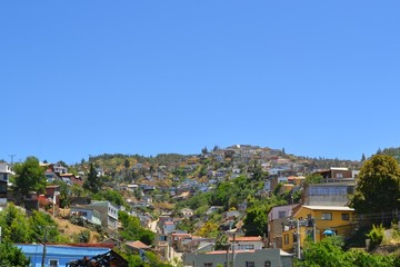 Fototapeta na wymiar Colorful buildings on the hills of Valparaiso, Chile