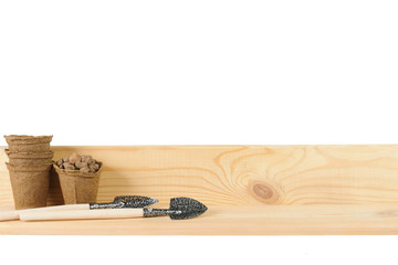 Garden shovels on wooden board