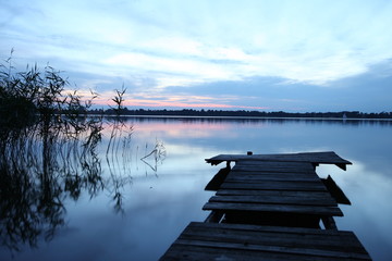 Fototapeta na wymiar old wooden pier at the lake