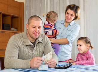 Happy family with banknotes