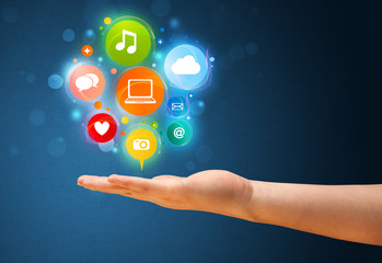 Multimedia icons in the hand of a woman