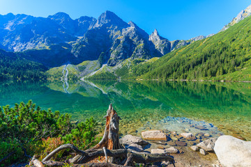 Green water mountain lake Morskie Oko, Tatra Mountains, Poland - obrazy, fototapety, plakaty
