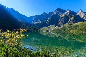 Fototapeta na wymiar Green water mountain lake Morskie Oko, Tatra Mountains, Poland