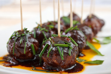 Cocktail meatballs with dark barbecue sauce