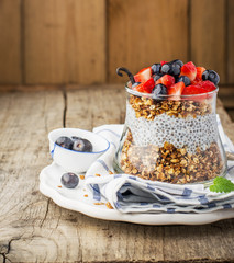Strawberry, blueberries, oatmeal and chia seeds pudding