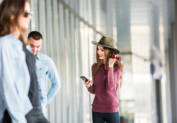  Young woman looking at a smartphone