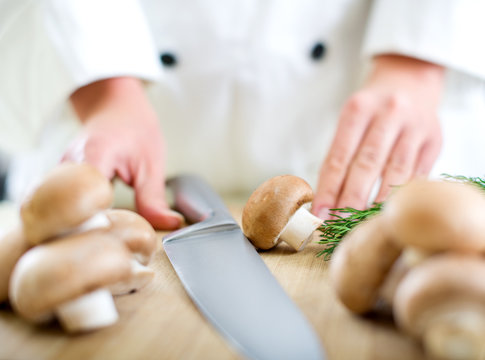 Chef chopping mushrooms