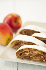 sliced into pieces apple strudel and fresh apples