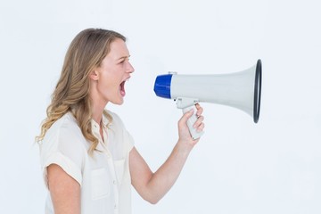 Fototapeta premium Woman shouting through a loudspeaker
