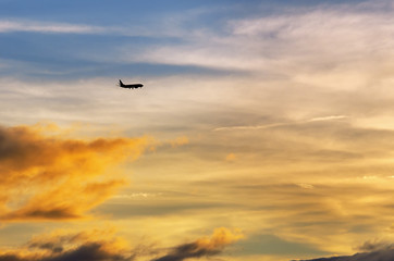 Fototapeta na wymiar Sunset and an airplane