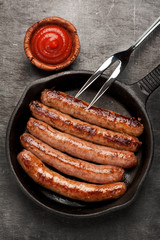 grilled sausages in a pan
