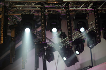 rays of spotlights at a concert