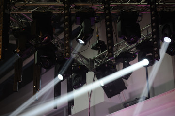 rays of spotlights at a concert