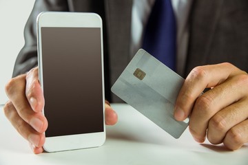 Businessman using smartphone for online shopping
