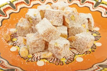 Turkish delight on plate on a white background