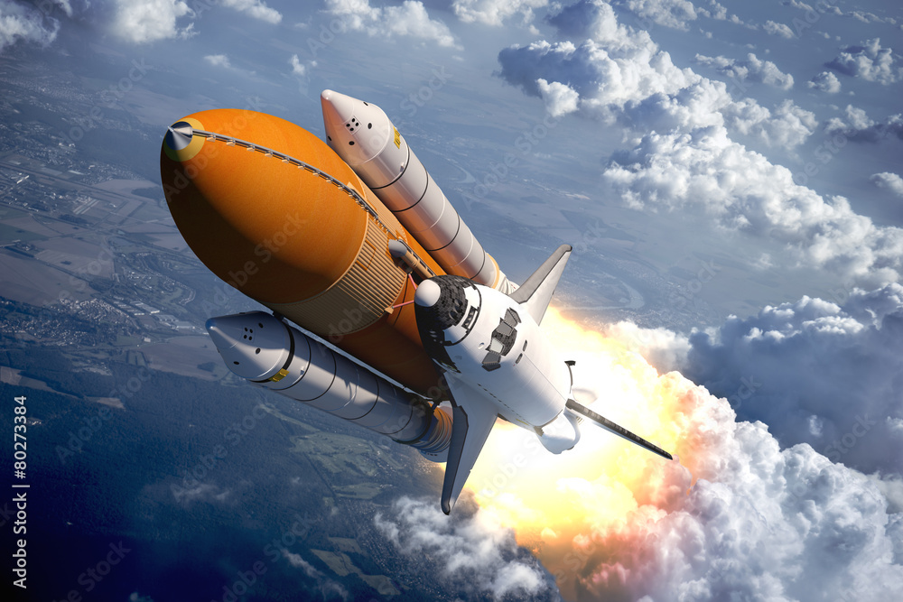 Wall mural space shuttle flying over the clouds