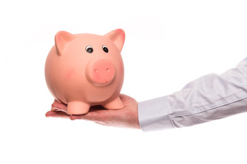 Hand holding a piggy bank