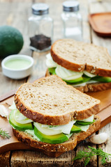 sandwiches with avocado, cheese, cabbage and cheese and herb top
