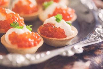 Tartlets with red caviar