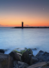 Fototapeta premium Seascape at sunset - lighthouse on the coast
