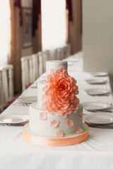 Wedding white cake with mastic and cream orange flower