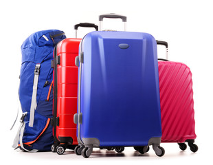 Suitcases and rucksack isolated on white