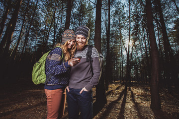 Happy young couple of tourists and taking selfie