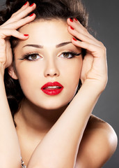 Beauty fashion woman with red nails and makeup