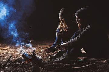 Couple tent camping in the wilderness
