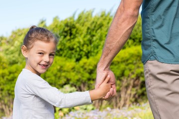Fototapeta premium Father and daughter holding hands