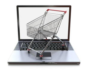 E-commerce. Shopping cart on laptop. Conceptual image