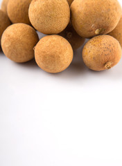 Longan fruit over white background