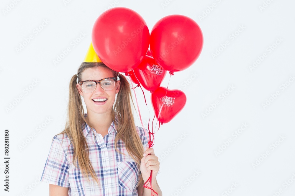 Poster geeky hipster smiling at camera and holding red balloons