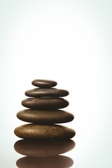 Fototapeta na wymiar Zen stones balancing on white background