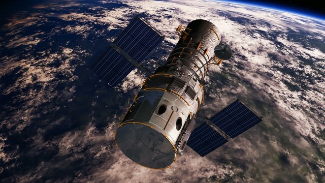 Hubble flying towards the dark side of the earth