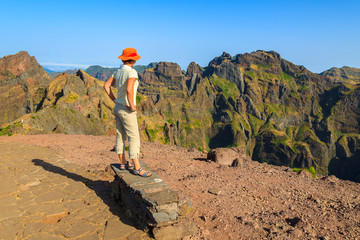 Woman tourist on mountain path, Madeira island, Portugal