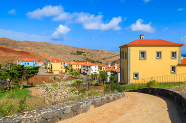 Fototapeta na wymiar Road Portuguese village with colorful houses, Madeira island