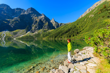 Woman tourist at Morskie Oko lake in summer, Tatra Mountains © pkazmierczak