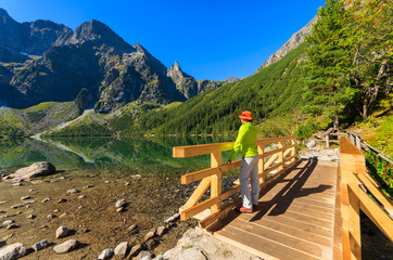 Woman tourist at Morskie Oko lake in summer, Tatra Mountains © pkazmierczak