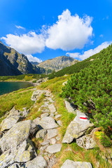 Hiking trail along Czarny Staw lake in summer, Tatra Mountains