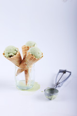 green tea ice cream cones in clear glasses
