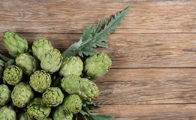 artichokes on aged table, top view