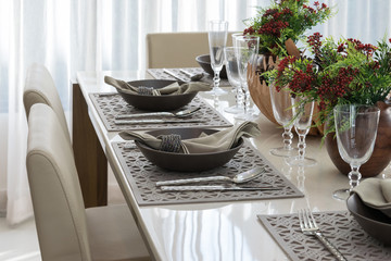 dining table and comfortable chairs in modern home with elegant