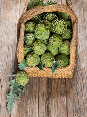 Artichokes with leaves in basket