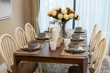 dining table and comfortable chairs in modern home with elegant