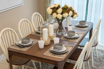 dining table and comfortable chairs in modern home with elegant