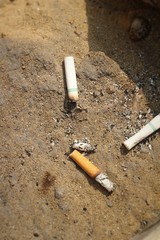 cigarette butts on the ground