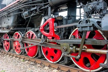 lower part of the locomotive on the railroad close up