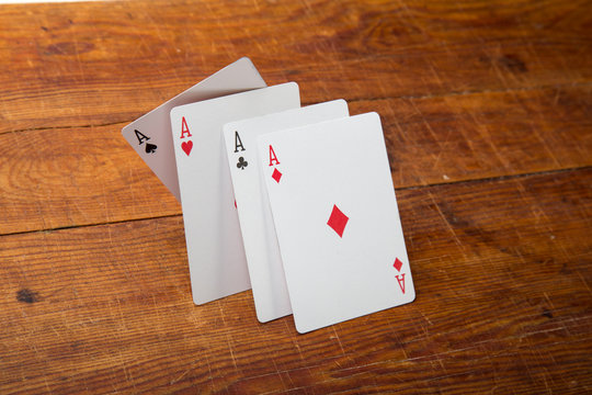 Aces on a wood background