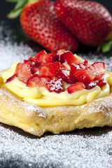 Zeppole with strawberry- tipical italian pastry